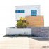 【東新町モデルハウス】外観はキューブが重なって見えるモダンなスタイル。玄関をコートラインでアクセントにして、箱が浮いているようにコートラインで演出しました。